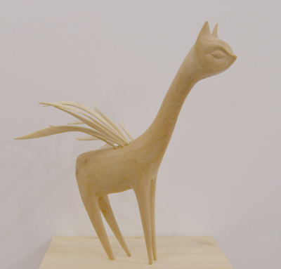 Wooden creatures "LONG NECK RISING" by TACH POLLARD