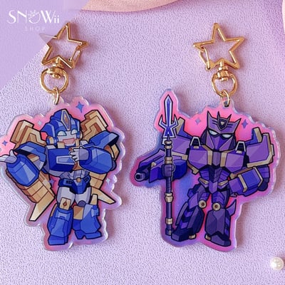 TF ONE Charms-Sentinel Prime & Megatronus Prime