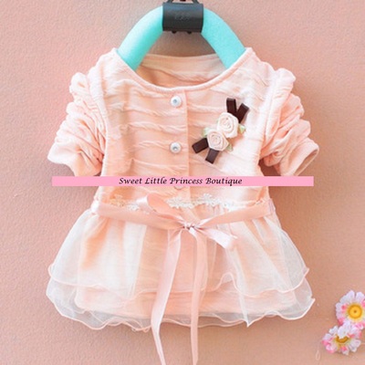 Pink cardigan with flowers, buttons, ribbon ties, lace trim and chiffon ruffles. Sizes 12/18m, 18/24m, and 3T