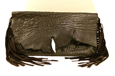 Bone feather fringe clutch