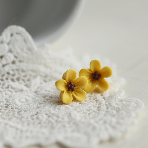 lucy. little wild flower stud earrings in romantic yellow colour