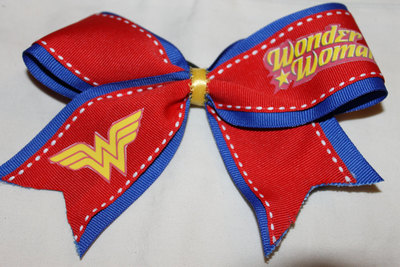 "WONDER WOMAN" - 2 in Blue Grosgrain Ribbon Layered with Red Ribbon with a Yellow Center Cheer Bow