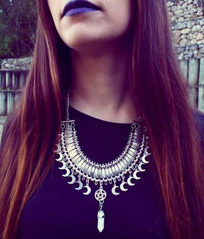 Statement crystal point necklace with moon pendants and a pentagram