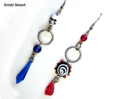 Mismatched Pirate skull earrings in red and blue
