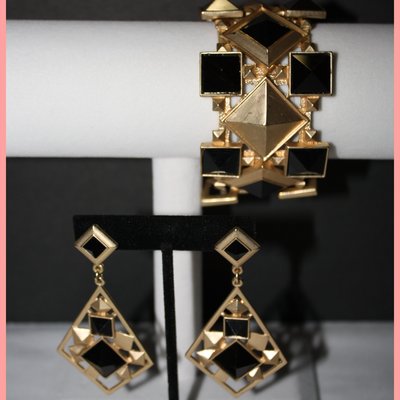 Gold chandelier earrings and matching chunky bracelet