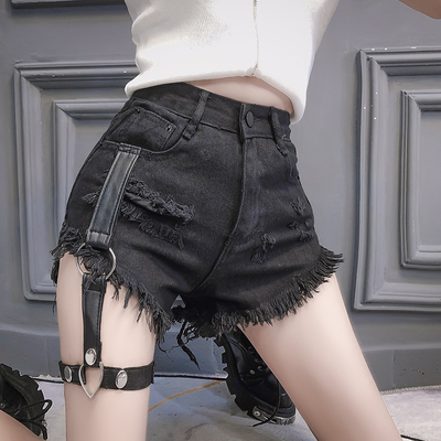 Black ripped denim shorts with garter belt
