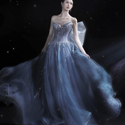 Blue strapless tulle long ball gown with bow