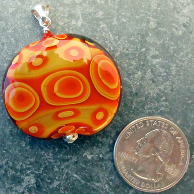 Orange and butternut flameworked pendant