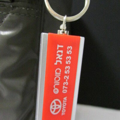 New red silver metal key chain fashion + flash light middle east edition toyota