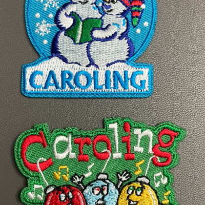 Caroling badge