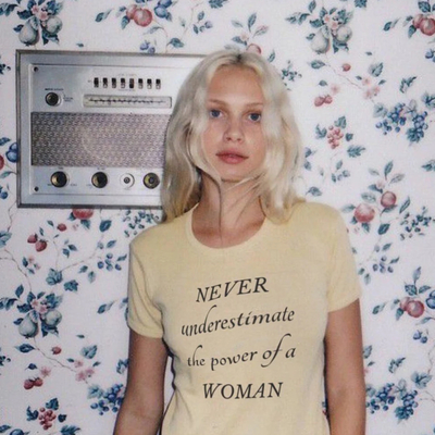 Never underestimate the power of a woman iconic tee in white