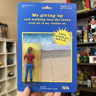 Giving up action figure - female/blue
