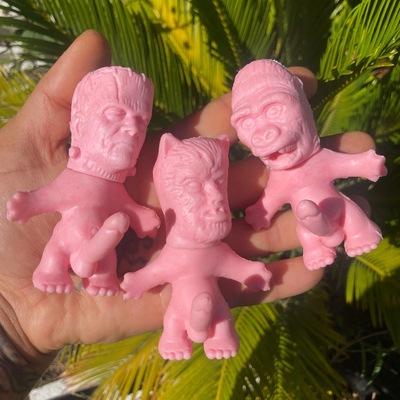 Horny monster - (unpainted pink rubber with solid black felt vest)