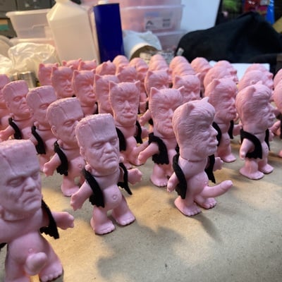 Horny monster - (unpainted pink rubber with solid black felt vest)