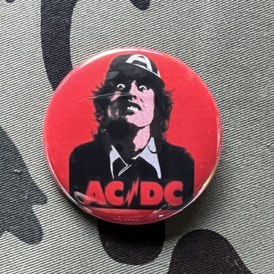 HIGH / VOLTAGE badge