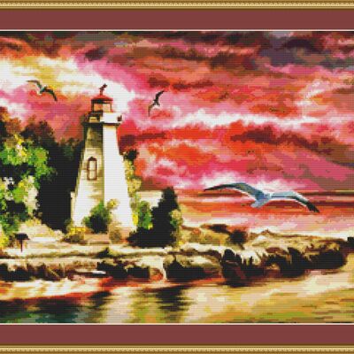 A lighthouse at sunset at sunset cross stitch pattern