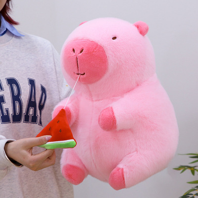 Pink capybara plush toy with watermelon