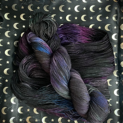 Astral sea hand dyed fingering weight sock yarn