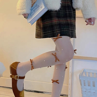 Pearl angelic bow tights - Thumbnail 1