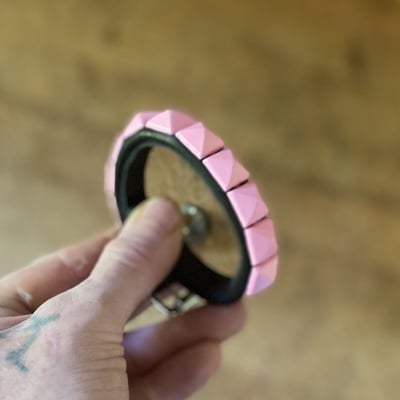 Pink pyramid stud wristband