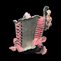 Golden Lily wearable ceramic corset by: Nicole Moan on Display at 50 Penn Place Art Gallery with display stand  - Thumbnail 5