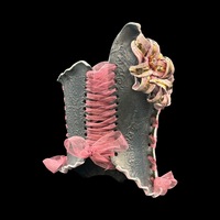 Golden Lily wearable ceramic corset by: Nicole Moan on Display at 50 Penn Place Art Gallery with display stand  - Thumbnail 6