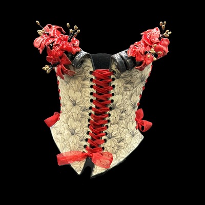 Red poppy wearable ceramic corset by: nicole moan on display at 50 penn place art gallery with matching stand