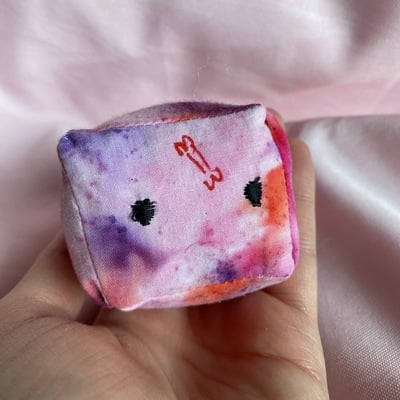 Pink and purple jellycube cat toy