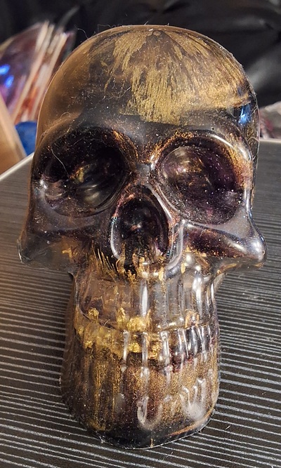 Purple and metallic gold resin skull