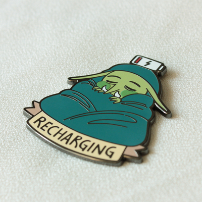 Recharging enamel pin