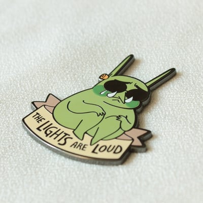 The lights are loud enamel pin