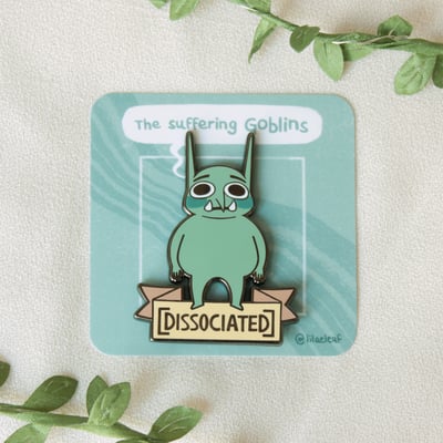 Dissociated enamel pin