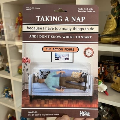 Taking a nap action figure (male)