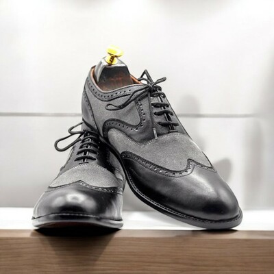 Handmade men's grey & black wingtip oxford leather shoes.