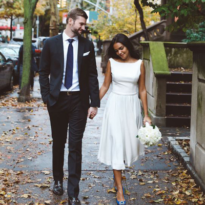 White satin and chiffon tea-length wedding dress