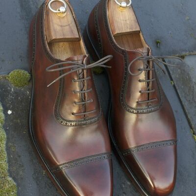 Timeless style and superior craftsmanship brown cap toe shoes