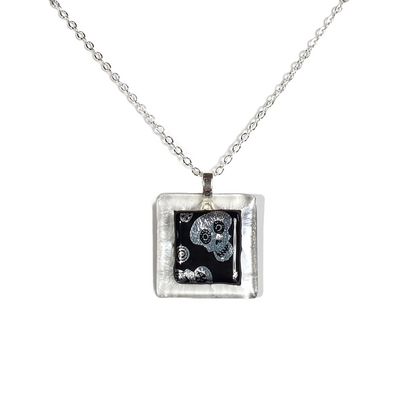 Dichroic silver skulls on clear fused glass pendant necklace