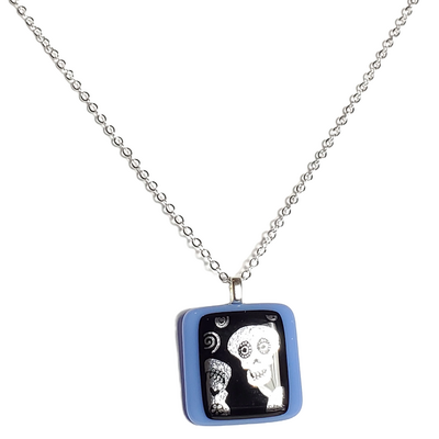 Dichroic silver skulls on blue fused glass pendant necklace