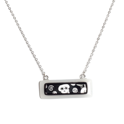 Dichroic silver skulls on white fused glass bar necklace