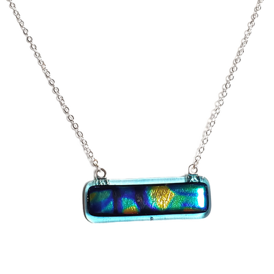 Dichroic abstract pattern on light blue transparent fused glass bar necklace