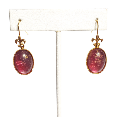 Red and gold speckled earrings on fleur de lis hooks