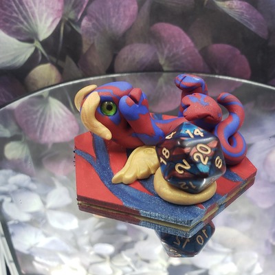 Playful blue and red dice guardian