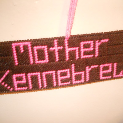 Needlepoint title wall hanging 