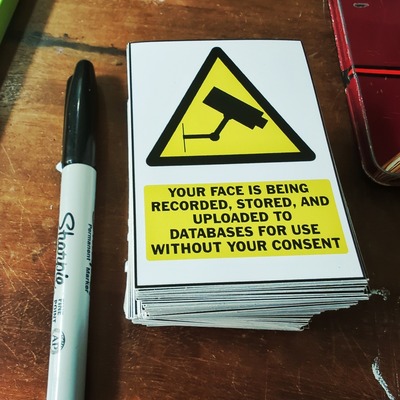 Facial recognition warning stickers