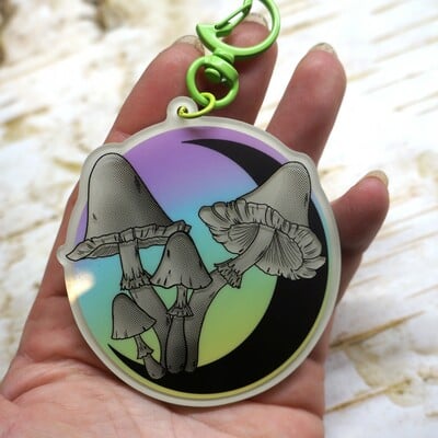 Green glow in the dark mushroom and moon keychain