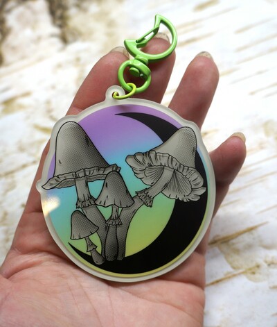 Green glow in the dark mushroom and moon keychain