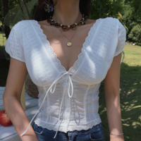 White lace V-neck top with ties on the chest - Thumbnail 1