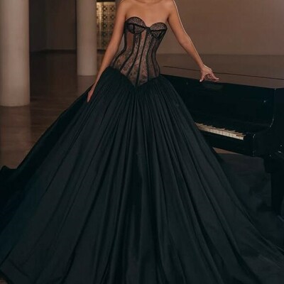 Black a-line prom gown with semi-sheer lace bodice