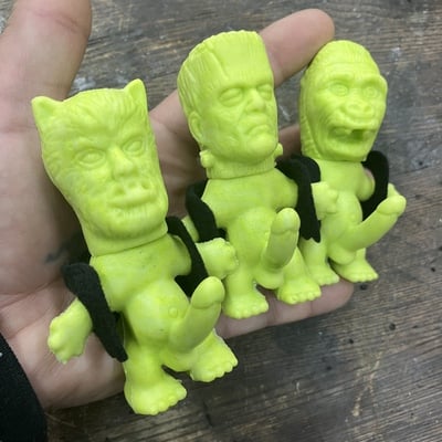 Horny monster - (unpainted green rubber with solid black felt vest)