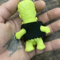 HORNY MONSTER - (UNPAINTED GREEN RUBBER WITH SOLID BLACK FELT VEST) - Thumbnail 1